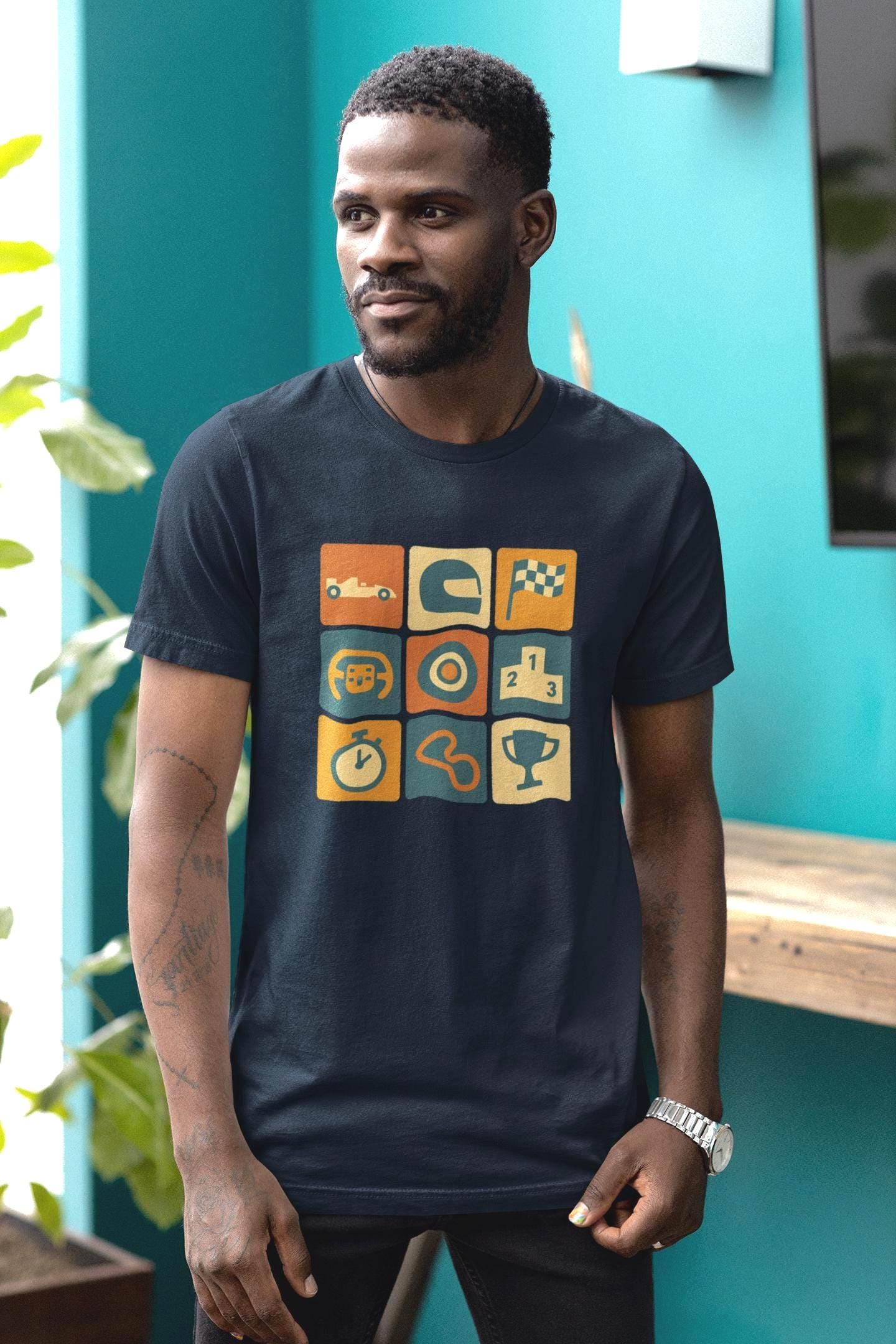 Retro Formula 1 racing icons t-shirt with vintage race car graphics, worn by man indoors