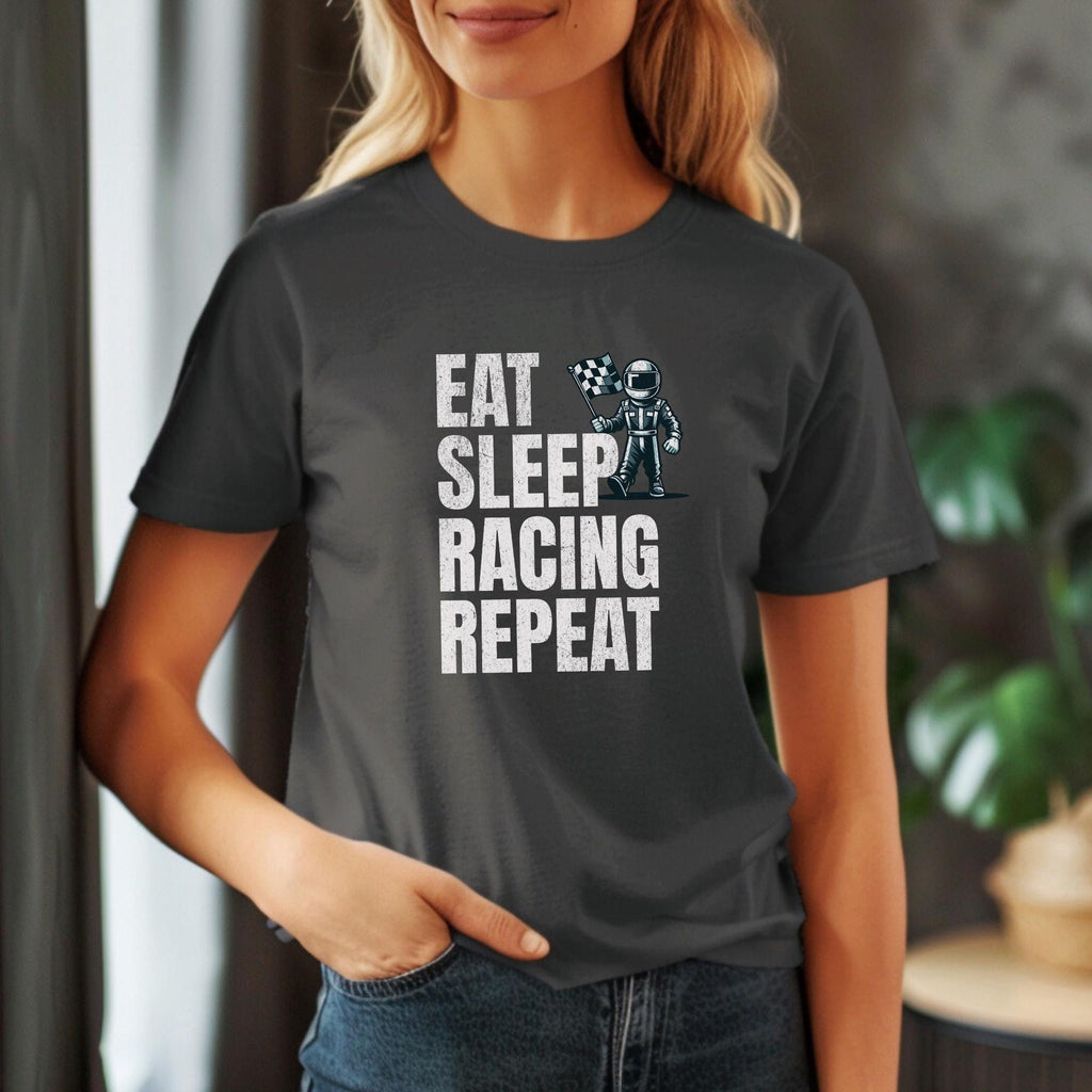 A dark gray t-shirt with the text &#39;EAT SLEEP RACING REPEAT&#39; in white. A cartoon illustration of a person in a racing suit holding a checkered flag is above the text.